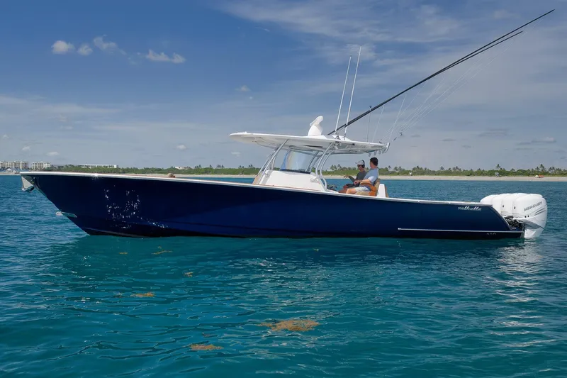 Slide: The Image of 2022 Valhalla Boatworks V-41 on clear blue water, side view with fishing rods. - 82