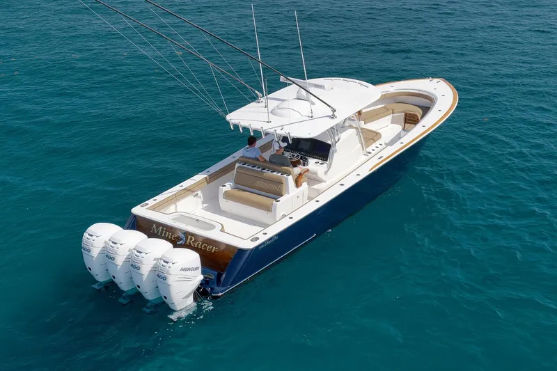 Slide: The Image of 2022 Valhalla Boatworks V-41 on clear blue water, featuring four powerful Mercury engines. - 88