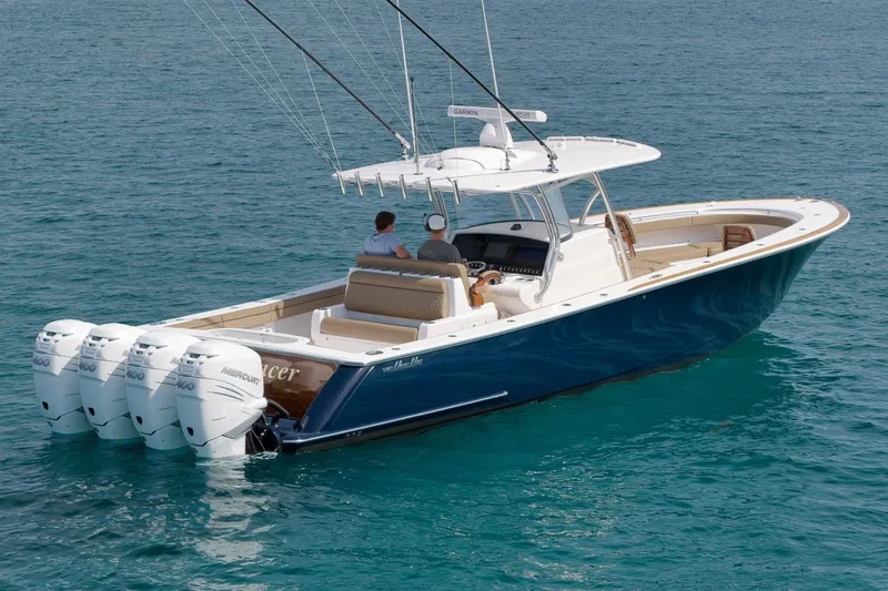 Slide: The Image of 2022 Valhalla Boatworks V-41 with four Mercury engines on clear blue water. - 89