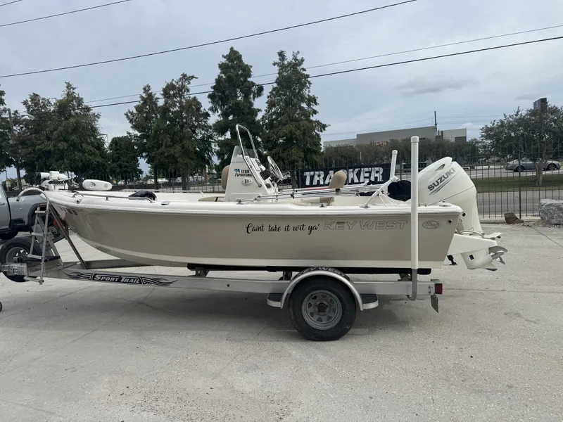 Slide: The Image of 2018 Key West 1720 Sportsman boat on trailer, parked outdoors. - 11