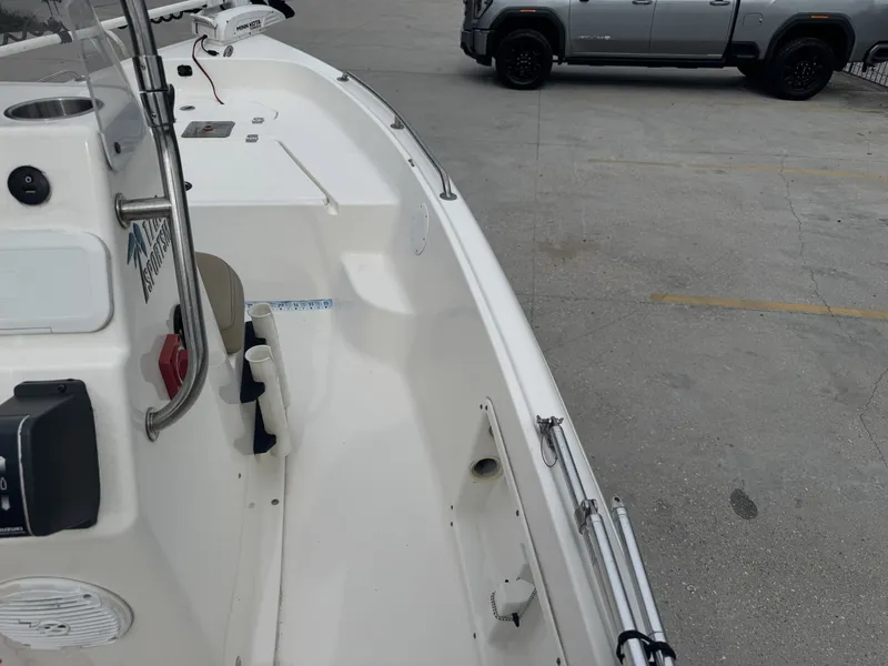 Slide: The Image of 2018 Key West 1720 Sportsman boat parked near a gray truck. - 14