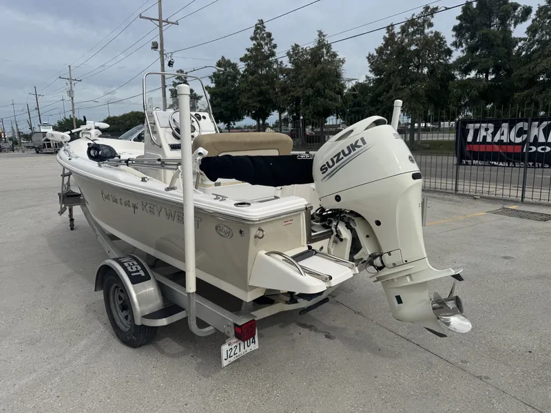 Slide: The Image of 2018 Key West 1720 Sportsman boat with Suzuki outboard motor on a trailer. - 4