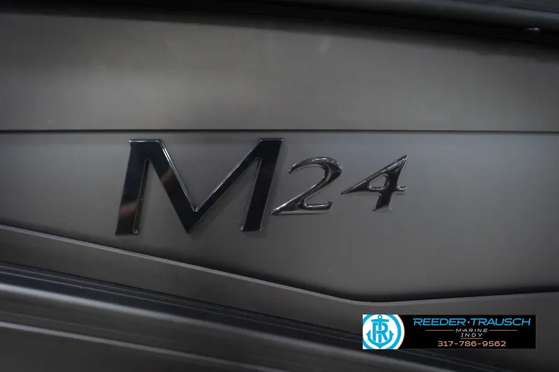 Slide: The Image of Close-up of 2026 Bennington 24 MFB model emblem on sleek surface. - 104