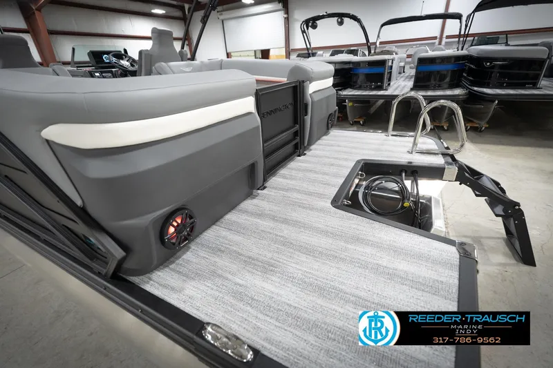 Slide: The Image of 2026 Bennington 24 MFB pontoon boat interior with seating and storage compartment. - 105