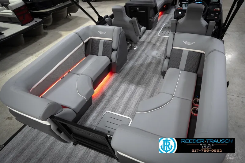 Slide: The Image of 2026 Bennington 24 MFB pontoon boat interior with gray seating and ambient lighting. - 13