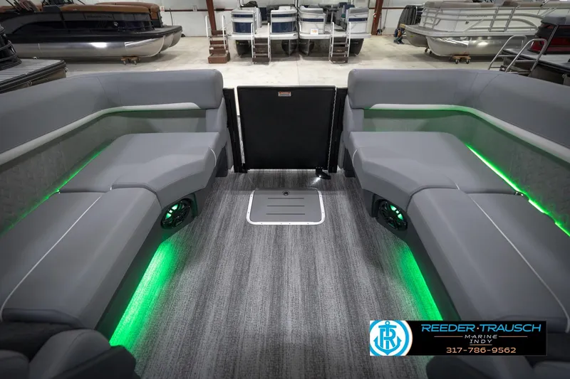 Slide: The Image of 2026 Bennington 24 MFB pontoon boat interior with gray seating and ambient lighting. - 17