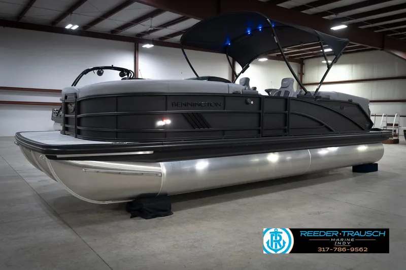Slide: The Image of Group enjoying a 2026 Bennington 24 MFB boat on water, promoting Reeder Trausch Marine services. - 3