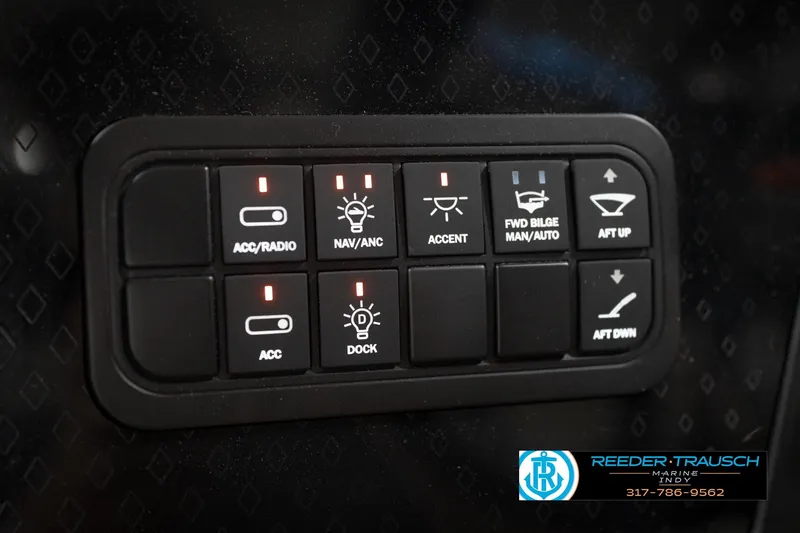 Slide: The Image of 2026 Bennington 24 MFB boat interior with storage compartments and cup holder. - 34