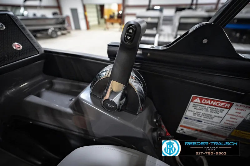 Slide: The Image of Interior of 2026 Bennington 24 MFB boat with modern steering and control panel. - 38