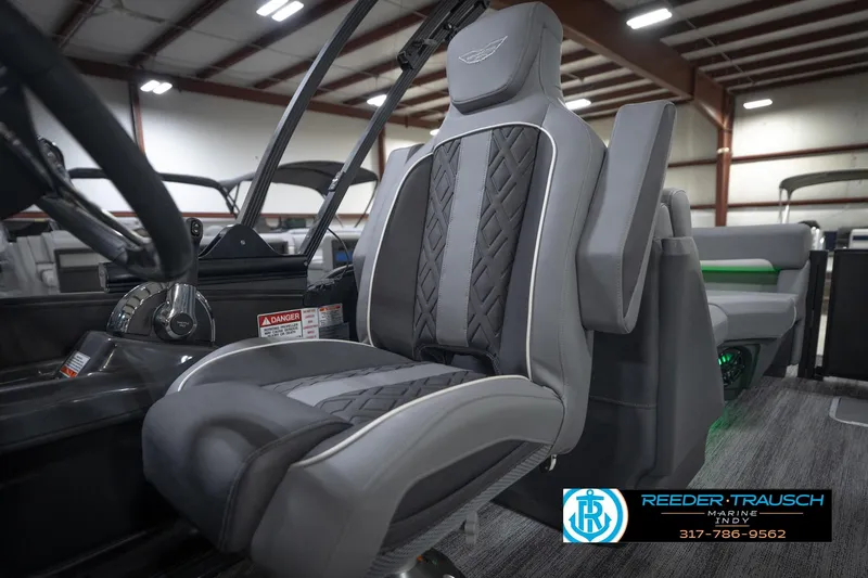 Slide: The Image of Close-up of 2026 Bennington 24 MFB steering wheel with logo detail. - 39