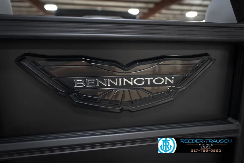 Slide: The Image of 2026 Bennington 24 MFB boat interior with gray seating and green LED lighting. - 48