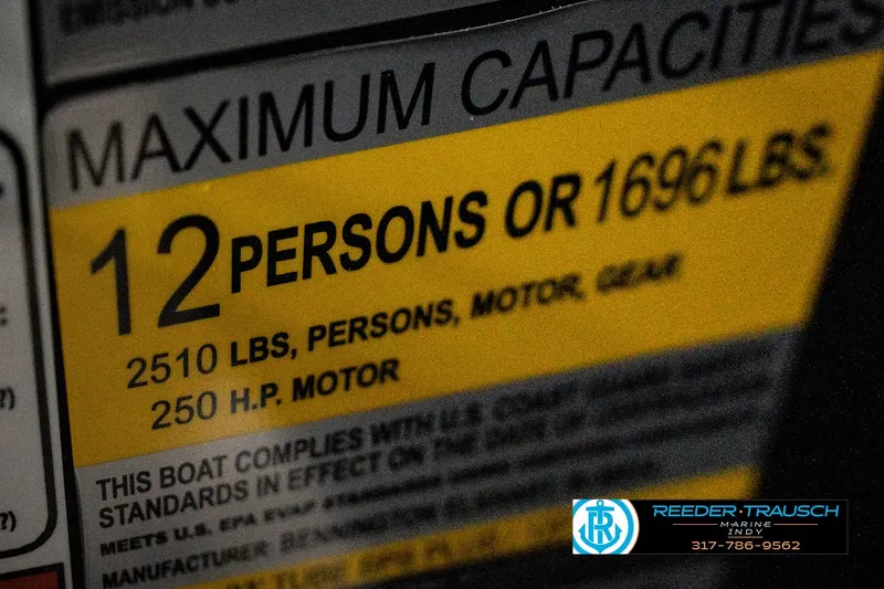 Slide: The Image of Illuminated cup holder on 2026 Bennington 24 MFB boat, featuring sleek design and green LED lighting. - 54