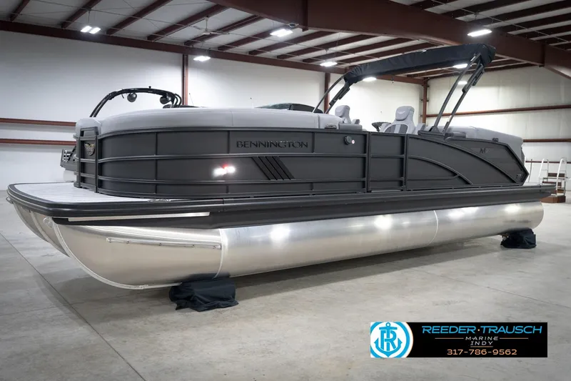Slide: The Image of 2026 Bennington 24 MFB pontoon boat in a showroom, sleek design, modern features. - 56