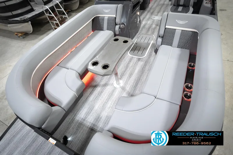 Slide: The Image of 2026 Bennington 24 MFB pontoon boat interior with gray seating and ambient lighting. - 65