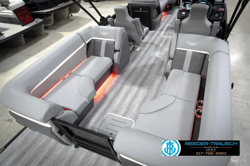 Slide: The Image of 2026 Bennington 24 MFB pontoon boat interior with gray seating and ambient lighting. - 67