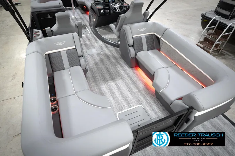 Slide: The Image of 2026 Bennington 24 MFB pontoon boat interior with gray seating and ambient lighting. - 68