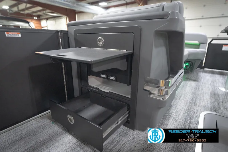 Slide: The Image of 2026 Bennington 24 MFB boat interior with storage compartments and modern design. - 83