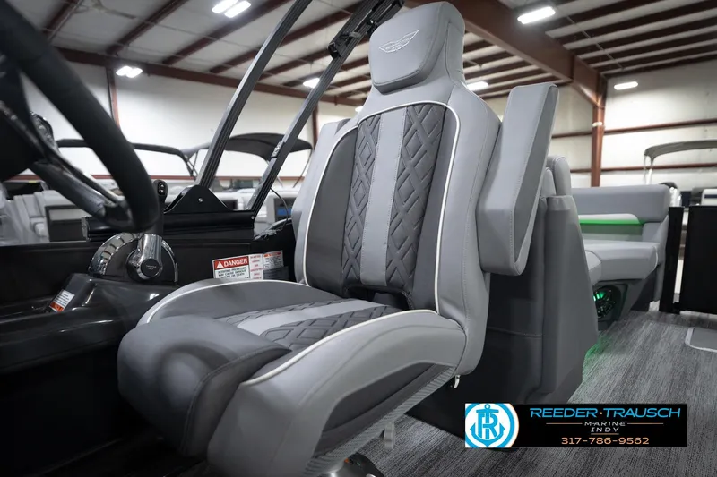 Slide: The Image of 2026 Bennington 24 MFB boat interior with luxurious gray seating and modern design. - 93