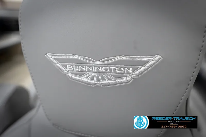 Slide: The Image of Gray Bennington 24 MFB 2026 boat seat with embroidered logo, Reeder-Trausch Marine contact details. - 94