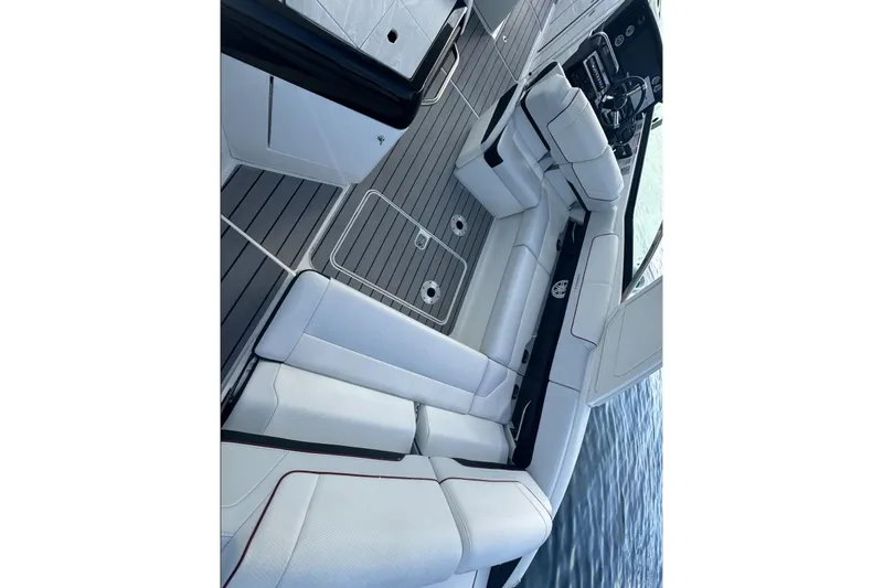 Slide: The Image of 2022 Formula 310 Bowrider OB interior with sleek seating and modern design on the water. - 16