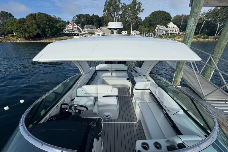 Slide: The Image of 2022 Formula 310 Bowrider OB docked, showcasing spacious seating and sleek design. - 17
