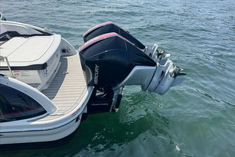 Slide: The Image of 2022 Formula 310 Bowrider OB with dual Mercury outboard engines on water. - 4