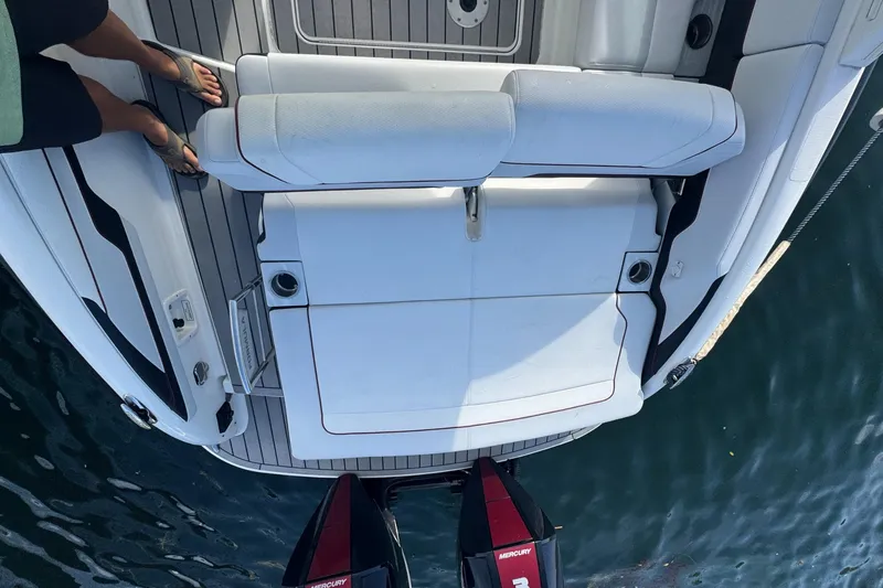 Slide: The Image of 2022 Formula 310 Bowrider OB boat with spacious seating and Mercury outboard engines. - 9