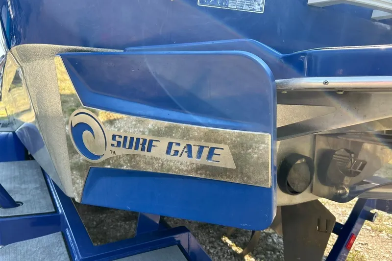 Slide: The Image of 2017 Malibu Wakesetter 25 LSV with Surf Gate feature, blue exterior detail. - 24