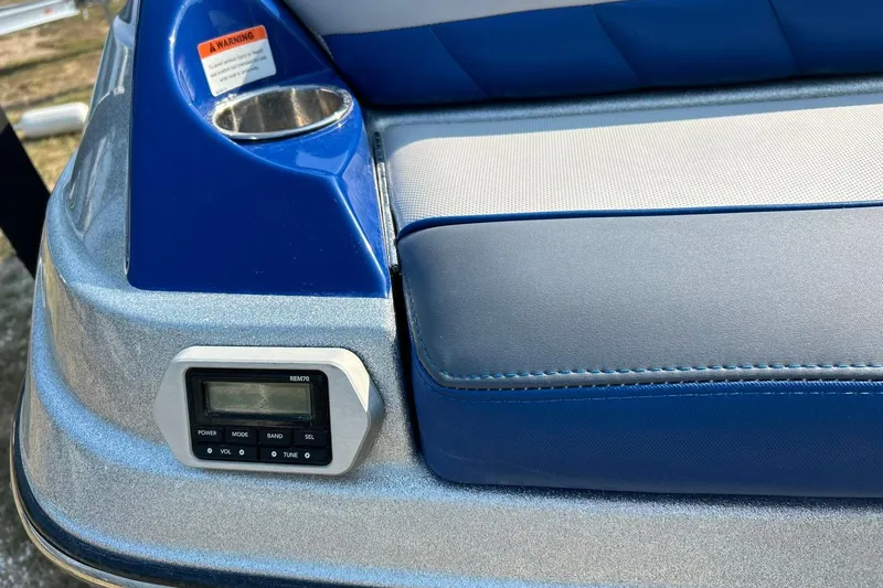 Slide: The Image of 2017 Malibu Wakesetter 25 LSV interior detail with blue upholstery and control panel. - 25