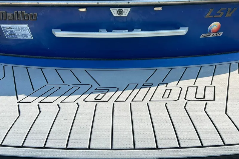 Slide: The Image of 2017 Malibu Wakesetter 25 LSV boat with Surf Gate feature, rear view. - 26