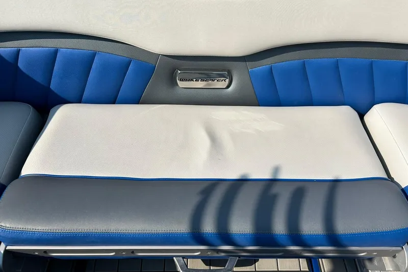 Slide: The Image of 2017 Malibu Wakesetter 25 LSV boat seat with blue and gray upholstery. - 29