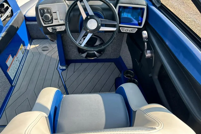 Slide: The Image of 2017 Malibu Wakesetter 25 LSV interior with steering wheel and control panel. - 41