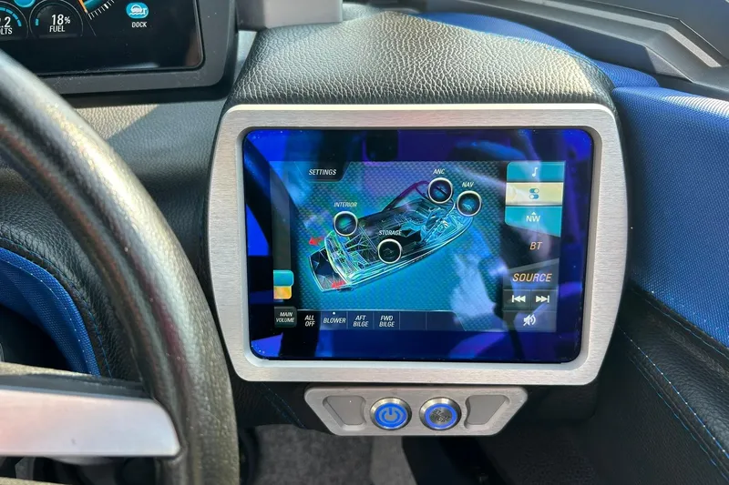 Slide: The Image of 2017 Malibu Wakesetter 25 LSV dashboard with touchscreen controls and settings display. - 43