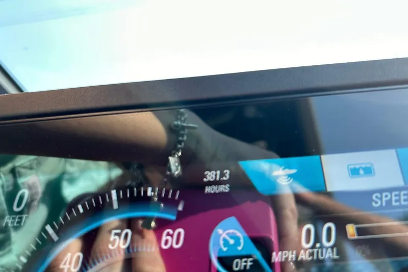 Slide: The Image of Dashboard of a 2017 Malibu Wakesetter 25 LSV showing 381.3 hours and speedometer. - 44