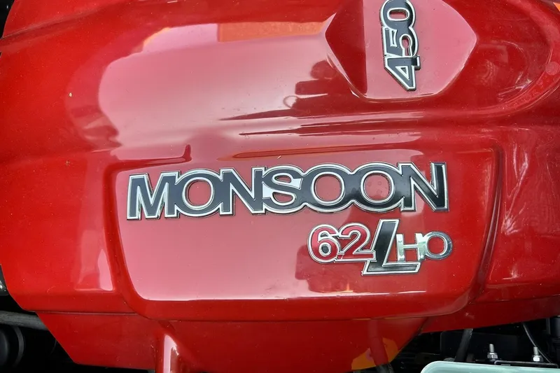 Slide: The Image of Red engine cover of 2017 Malibu Wakesetter 25 LSV, featuring "Monsoon 62 LHO" branding. - 51