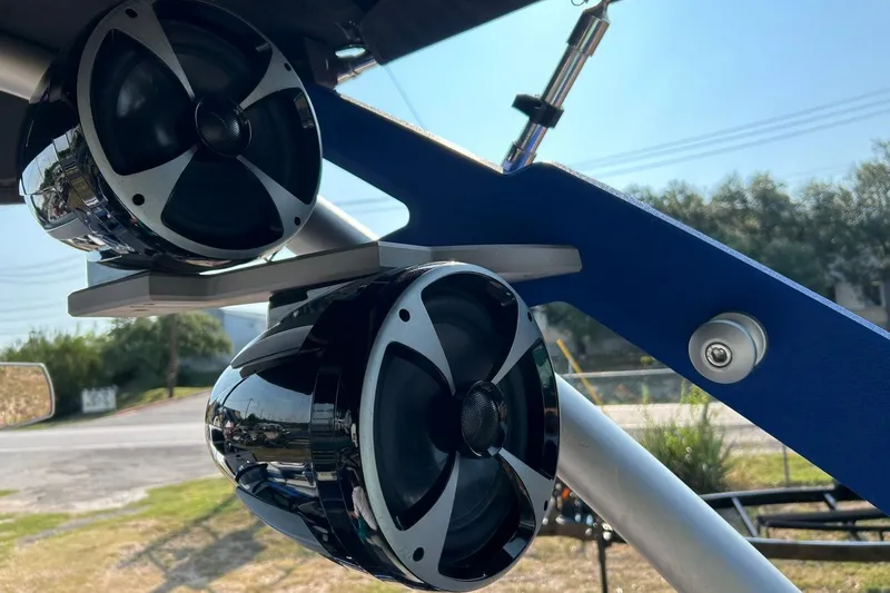 Slide: The Image of 2017 Malibu Wakesetter 25 LSV boat speakers mounted on a blue frame. - 55