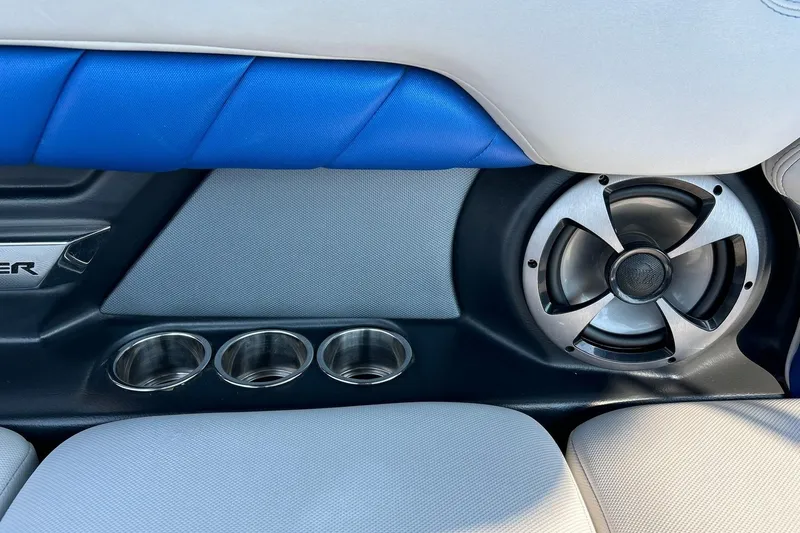 Slide: The Image of Interior of 2017 Malibu Wakesetter 25 LSV with speaker and cup holders. - 58