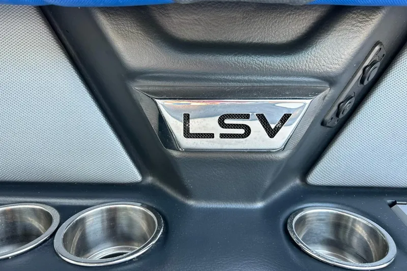 Slide: The Image of 2017 Malibu Wakesetter 25 LSV interior detail with cup holders and LSV emblem. - 62