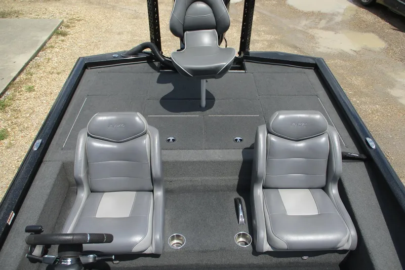 Slide: The Image of 2021 Avid 20XB boat interior with three gray seats and steering wheel. - 15
