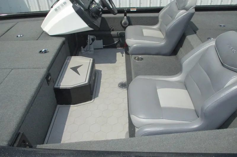 Slide: The Image of 2021 Avid 20XB boat interior with gray seating and hexagonal floor design. - 16