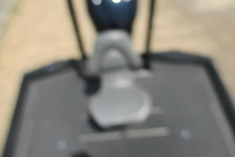 Slide: The Image of Blurry image of a 2021 Avid 20XB boat interior, focusing on the seating area. - 17