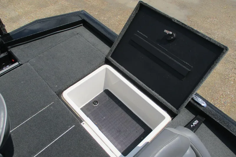 Slide: The Image of 2021 Avid 20XB boat storage compartment with open lid, showcasing interior space. - 18