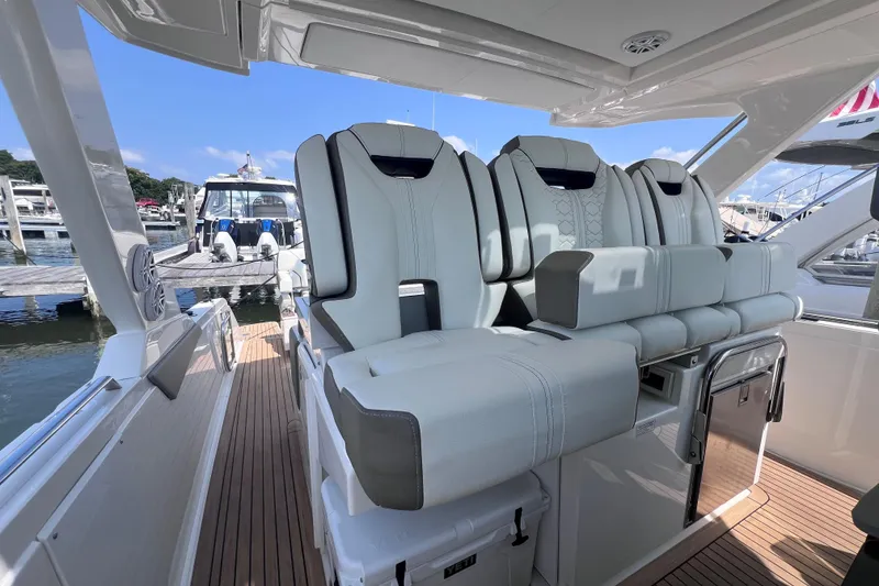 Slide: The Image of Luxurious seating on 2022 Tiara Yachts 34 LS, docked at marina. - 12