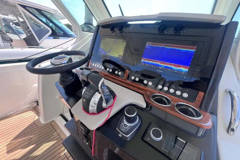 Slide: The Image of 2022 Tiara Yachts 34 LS helm with advanced navigation and control systems. - 13
