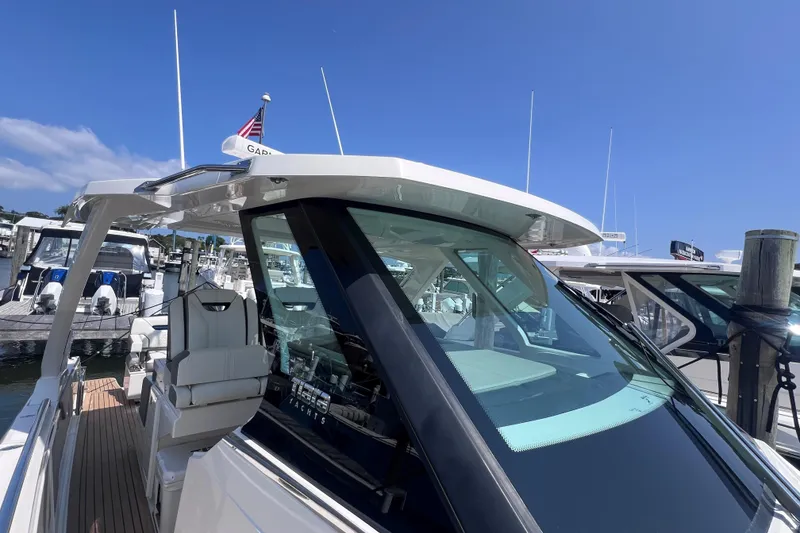 Slide: The Image of 2022 Tiara Yachts 34 LS docked, showcasing sleek design and modern features. - 18