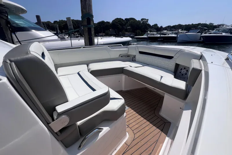 Slide: The Image of Luxurious seating area on 2022 Tiara Yachts 34 LS, docked in a marina. - 21