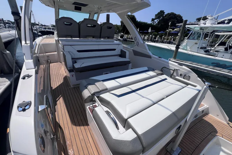 Slide: The Image of 2022 Tiara Yachts 34 LS luxury boat with spacious seating and sleek design. - 6