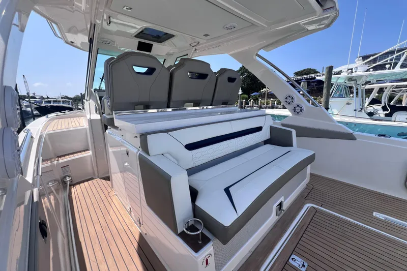 Slide: The Image of 2022 Tiara Yachts 34 LS interior with luxurious seating and modern design. - 9