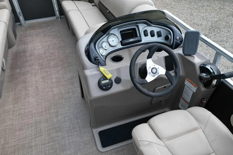Slide: The Image of 2020 Sun Tracker Party Barge 20 DLX interior with steering console and seating. - 10