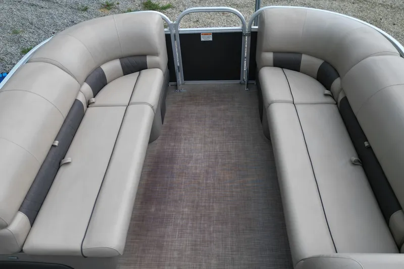 Slide: The Image of 2020 Sun Tracker Party Barge 20 DLX interior with beige seating and spacious layout. - 11
